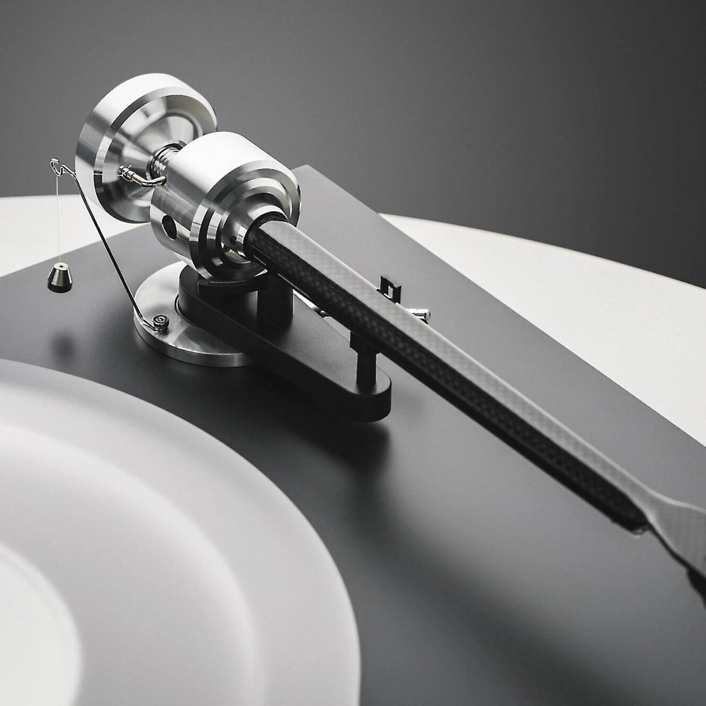 Pro-Ject Debut Reference 10 manual turntable with sleek design, featuring a tonearm and platter for high-quality vinyl playback.