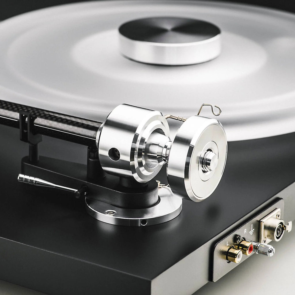 Pro-Ject Debut Reference 10 manual turntable with a sleek black finish and tonearm, showcasing high-quality audio equipment.