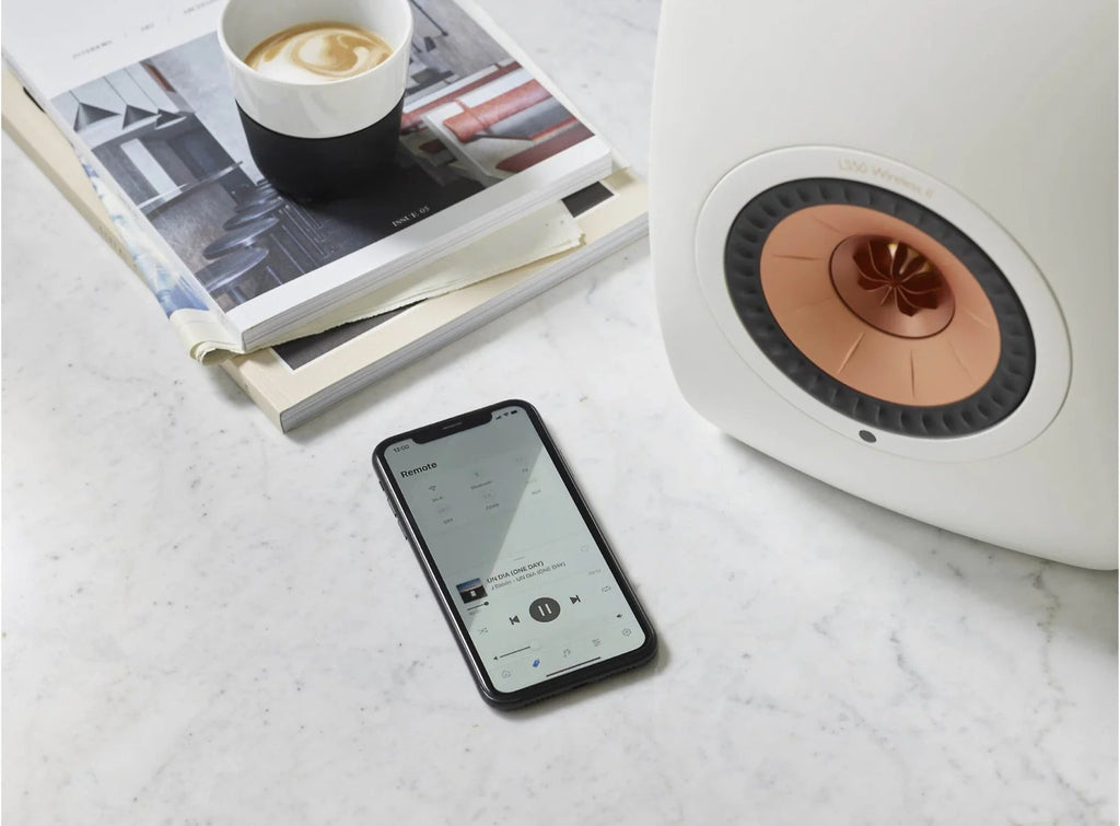 KEF LS50 Wireless II wireless speakers with sleek black finish and modern design, front view showing speaker grille and controls