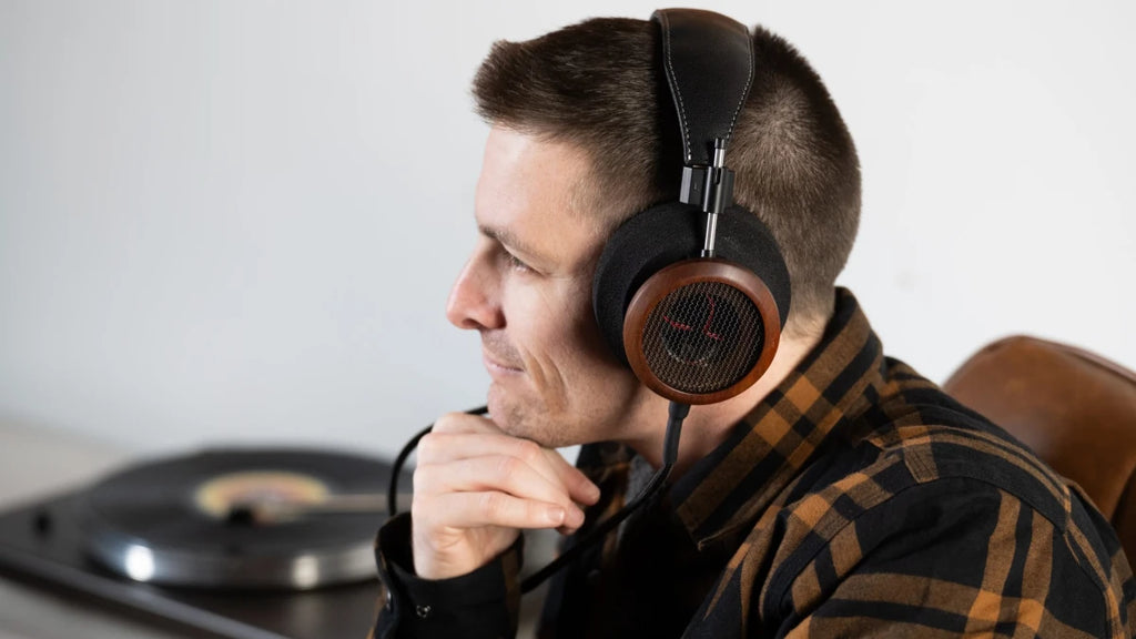 Wired Grado Signature S950 audiophile headphones with gold accents and open-back design, shown from a side angle.