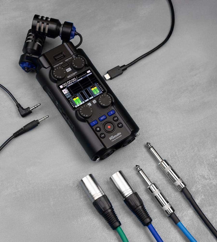 Zoom H5studio digital recorder with multiple input ports and controls, shown in a close-up image.