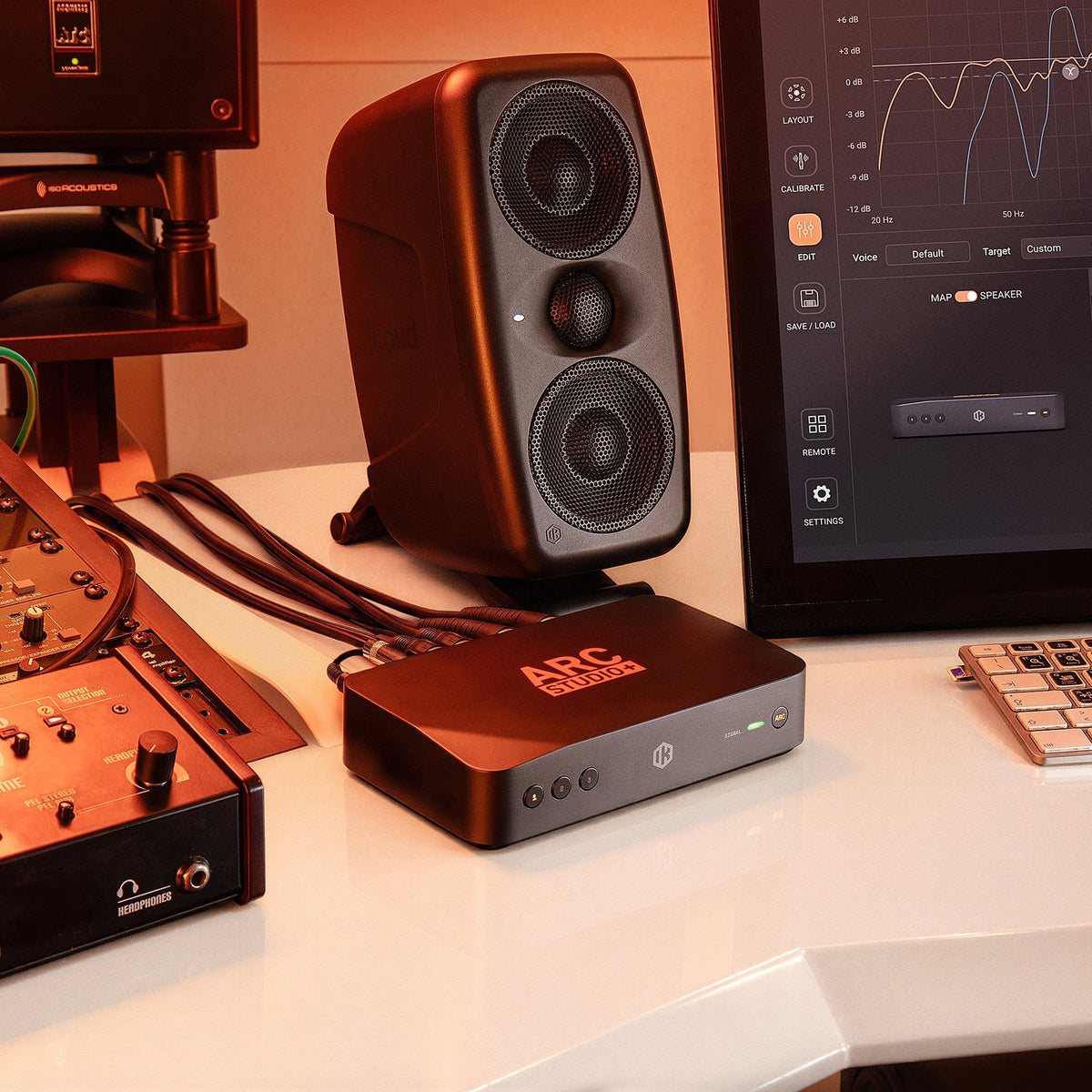 IK Multimedia ARC Studio+, next to a studio monitor and ARC X on screen