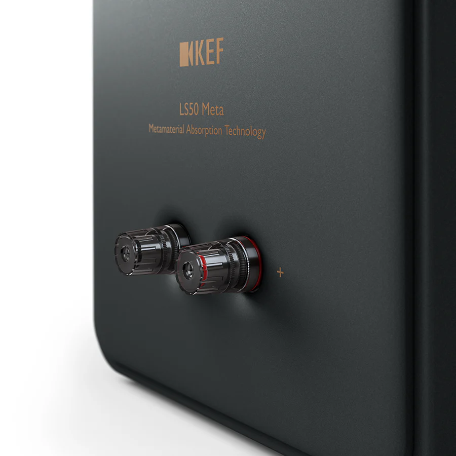 KEF LS50 Meta passive bookshelf speakers with black enclosures and sleek design, showcasing high-quality audio equipment.
