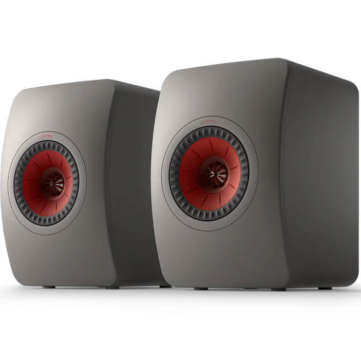 KEF LS50 Meta passive bookshelf speakers with sleek black cabinets and gold accents, designed for high-quality audio.