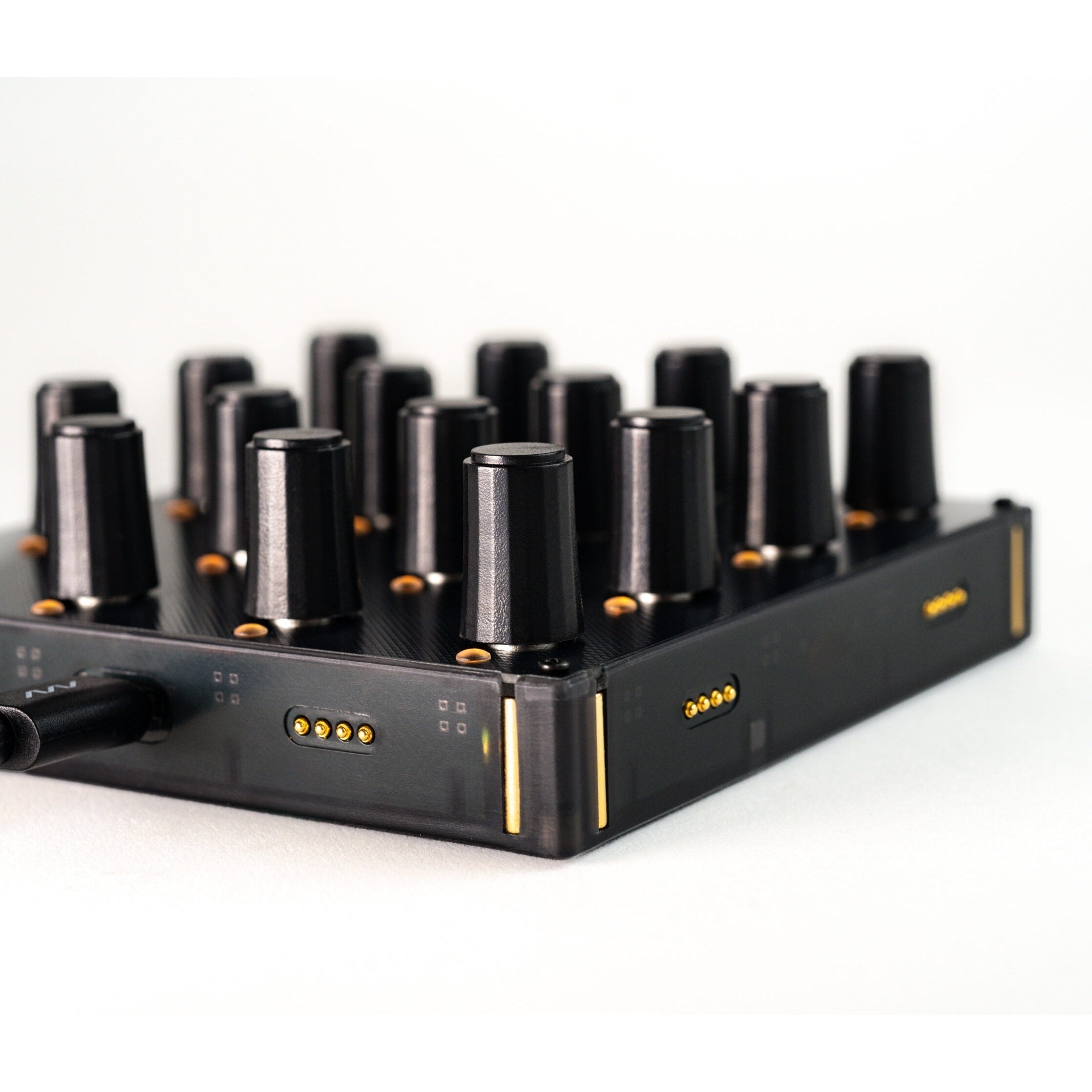 Intech Studio EN16 Detent Series 3 MIDI controller with rotary knobs and control buttons, close-up view.