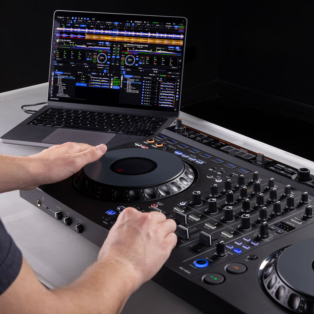 AlphaTheta DDJ-GRV6 DJ controller showing jog wheels, control buttons, and input ports on a sleek black surface.
