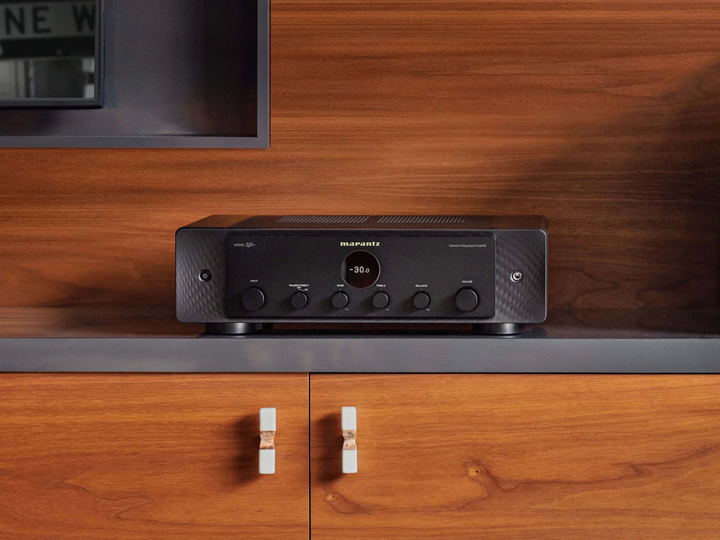 Black Marantz MODEL 40n stereo amplifier with sleek design and control knobs, shown in a studio setting.