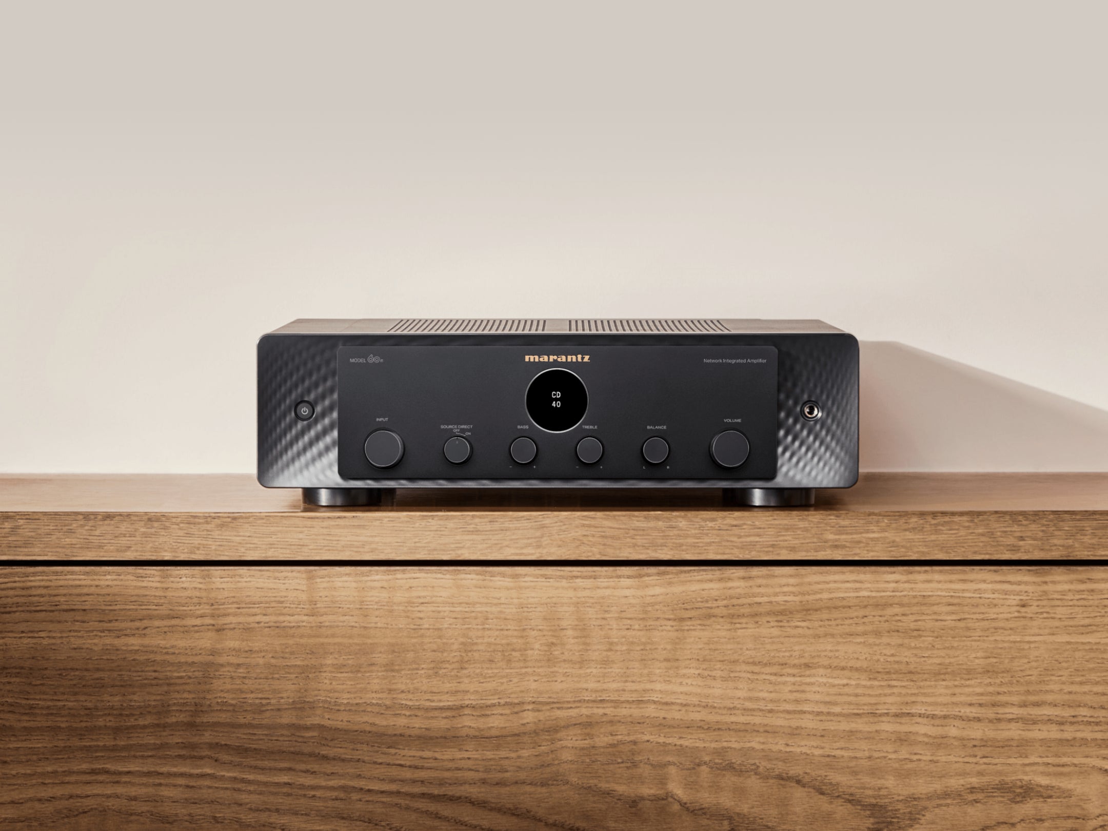 Marantz MODEL 60n stereo amplifier with sleek design and control knobs, showcasing high-quality audio equipment.