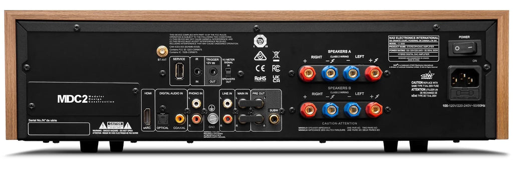 Rear view of NAD C 3050 stereo amplifier showing input and output ports on the integrated amplifier.