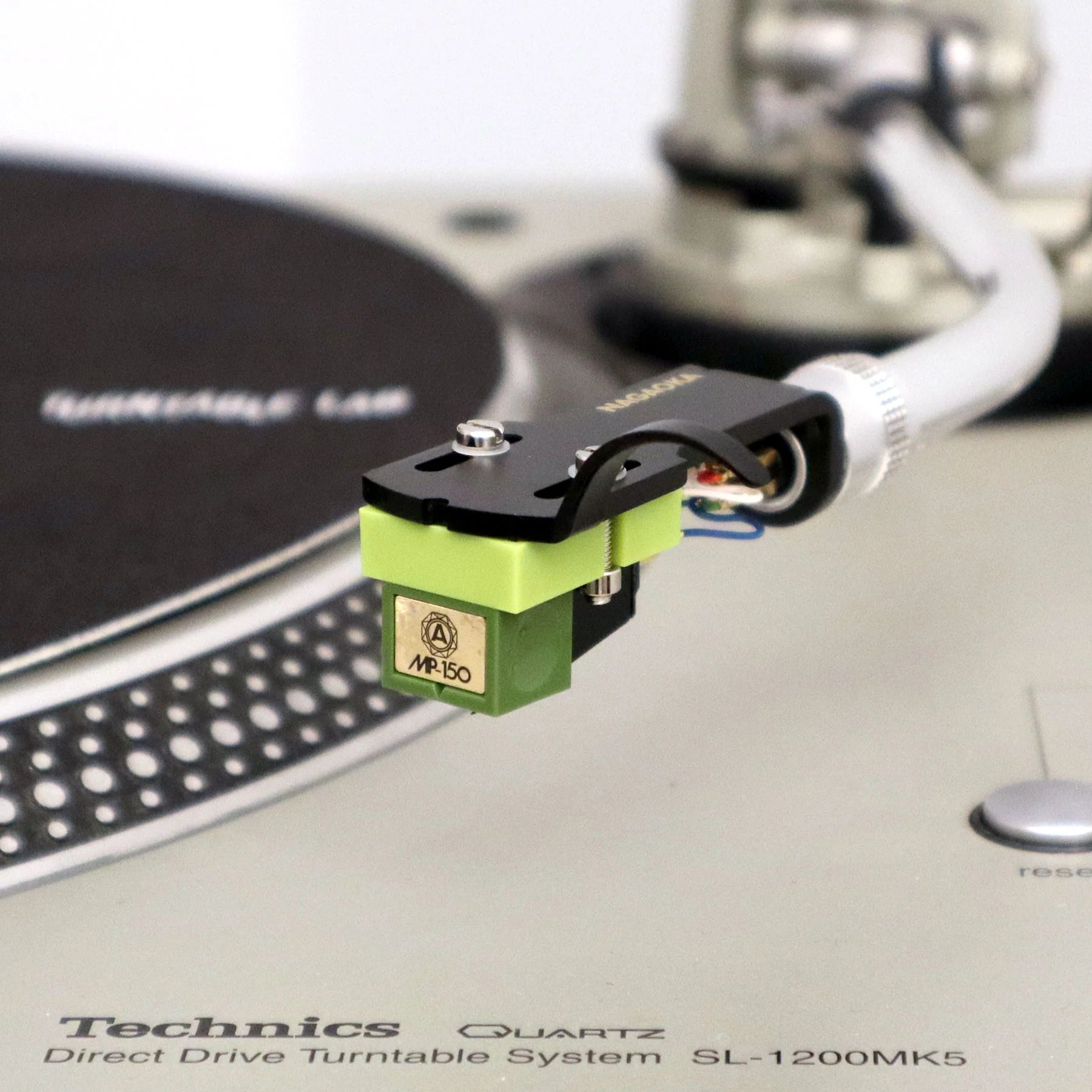 Nagaoka MP-150 turntable cartridge with stylus, black body, and mounting hardware for high-quality vinyl playback.