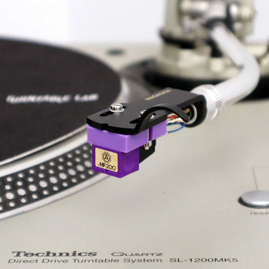 Nagaoka MP-200H turntable cartridge with headshell, black stylus and detailed metal body for high-quality vinyl playback.