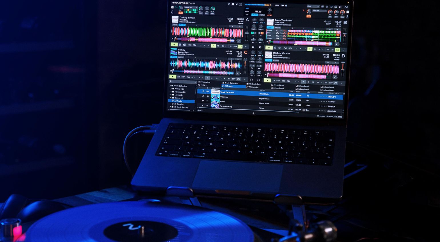 Native Instruments Traktor Pro 4 DJ software interface displayed on a computer screen, featuring waveforms and control panels.