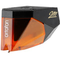 Ortofon 2M Bronze turntable cartridge with stylus and detailed metal body, designed for high-quality vinyl playback.