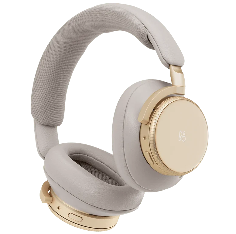 Bang & Olufsen Beoplay H100 wireless headphones in hourglass sand color, showing sleek over-ear design from a side perspective