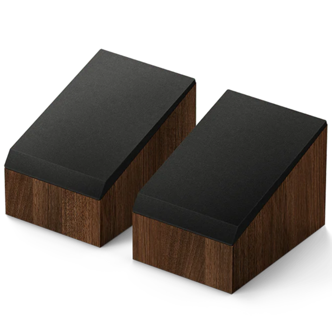 KEF Q8 Meta Dolby Atmos speakers showing sleek black speaker units with metal grilles and branding in a modern home setting.