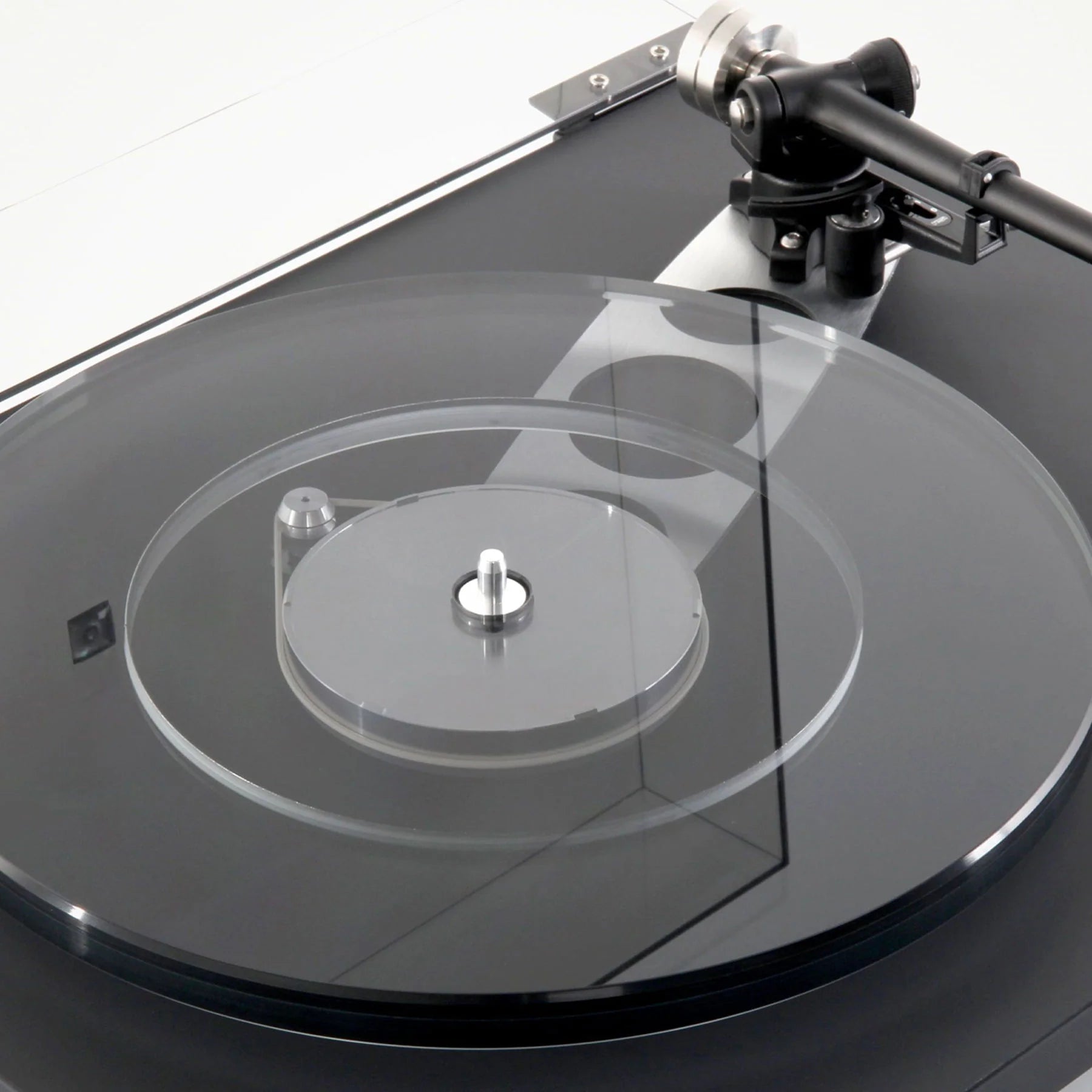 Rega Planar 6 turntable in Polaris Grey with Nd5 cartridge, showcasing the sleek design and tonearm in a close-up view.
