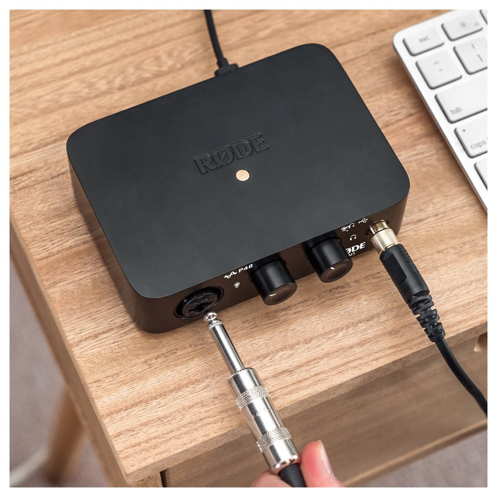 Rode AI-1 audio interface with sleek design, featuring input and output ports for professional recording and streaming.