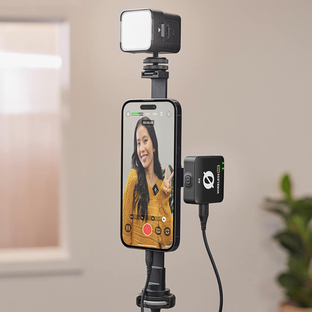 Rode Magnetic Mount attached to a tripod, supporting a microphone or camera rig, with a sleek black design and magnetic attachment point.