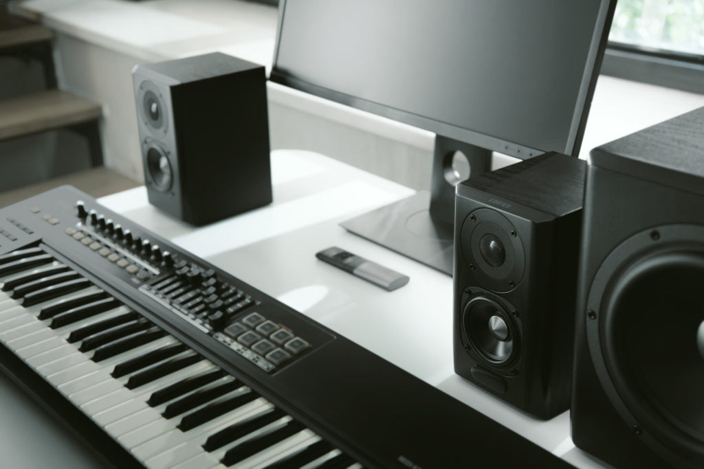 Pair of Edifier S351DB desktop speakers with a subwoofer, featuring wood finish and modern design for home audio setup.