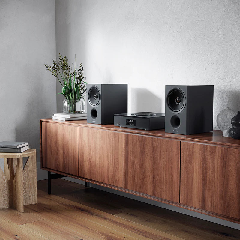 Technics SA-C600 stereo amplifier with sleek black design and control knobs visible on the front panel.