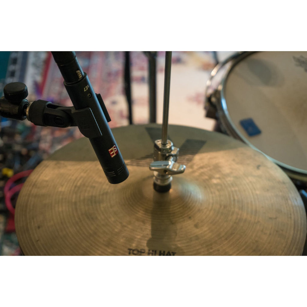 sE Electronics sE7 condenser microphone shown on a stand, with a black body and metal grille, ideal for studio recording.