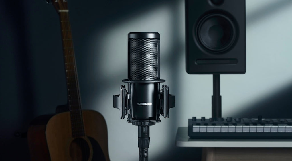 Shure SM4 condenser microphone with a sleek black body and grille, suitable for professional audio recording and live performances.