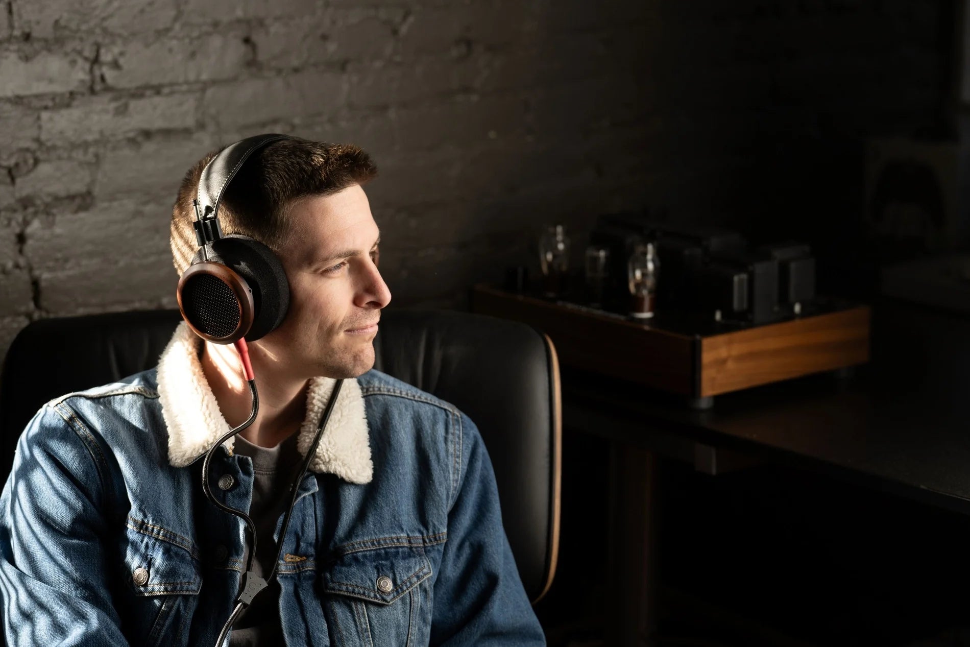 Wired Grado Signature S950 headphones with open-back design and premium wood ear cups, shown from a side angle.
