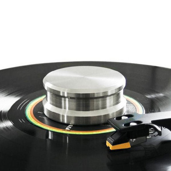 Silver Tonar record weight for vinyl turntables, stabilizer and 45 RPM adapter, designed to improve sound quality and reduce vibrations.