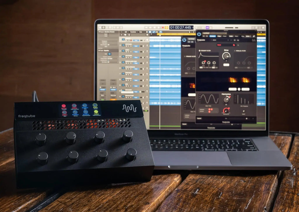 Freqport FreqTube FT1 effects and accessories device with controls and ports, used for audio processing and sound enhancement.