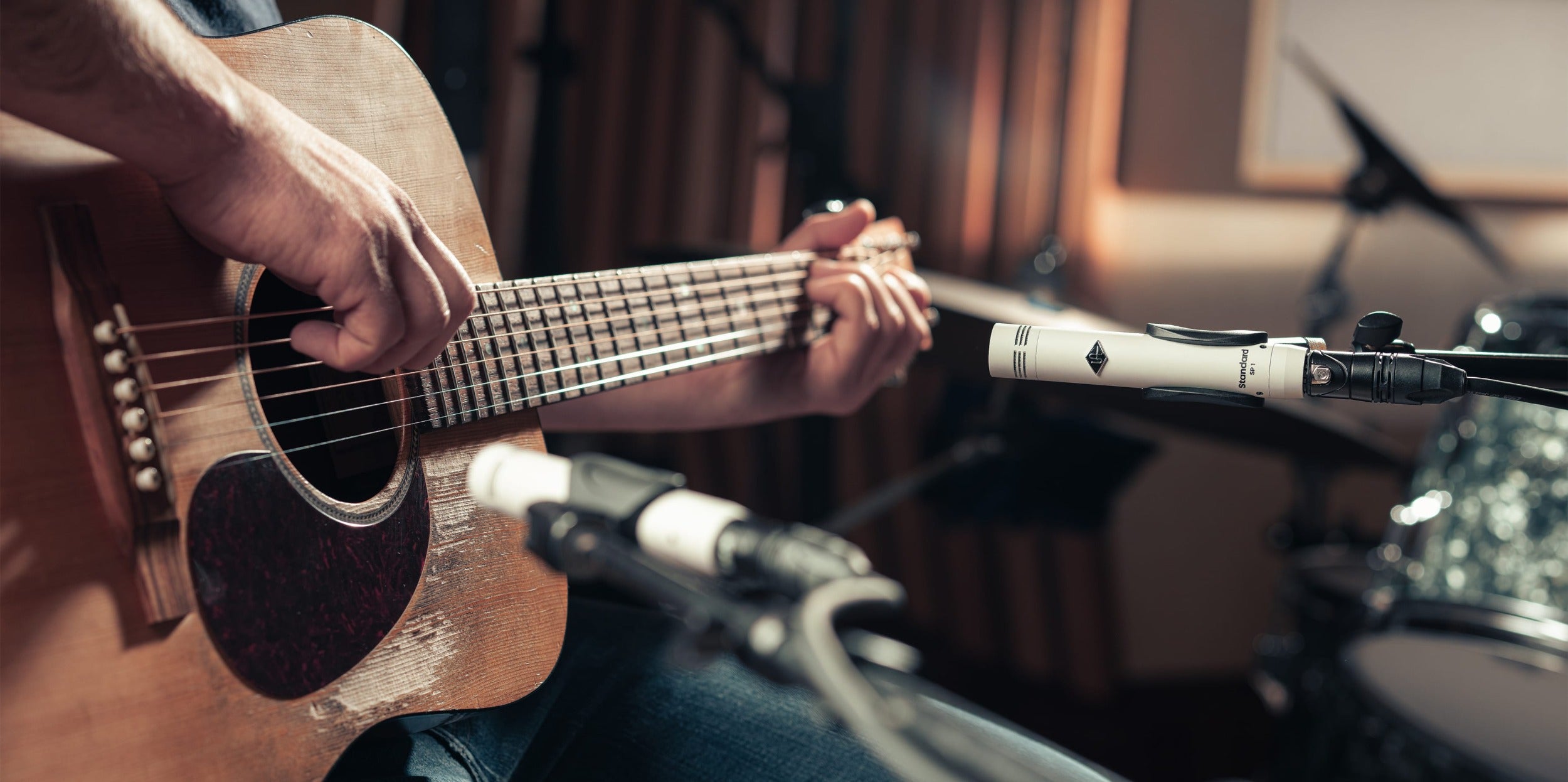 Universal Audio SP-1 condenser microphone with sleek design and professional audio quality, ideal for studio recording.