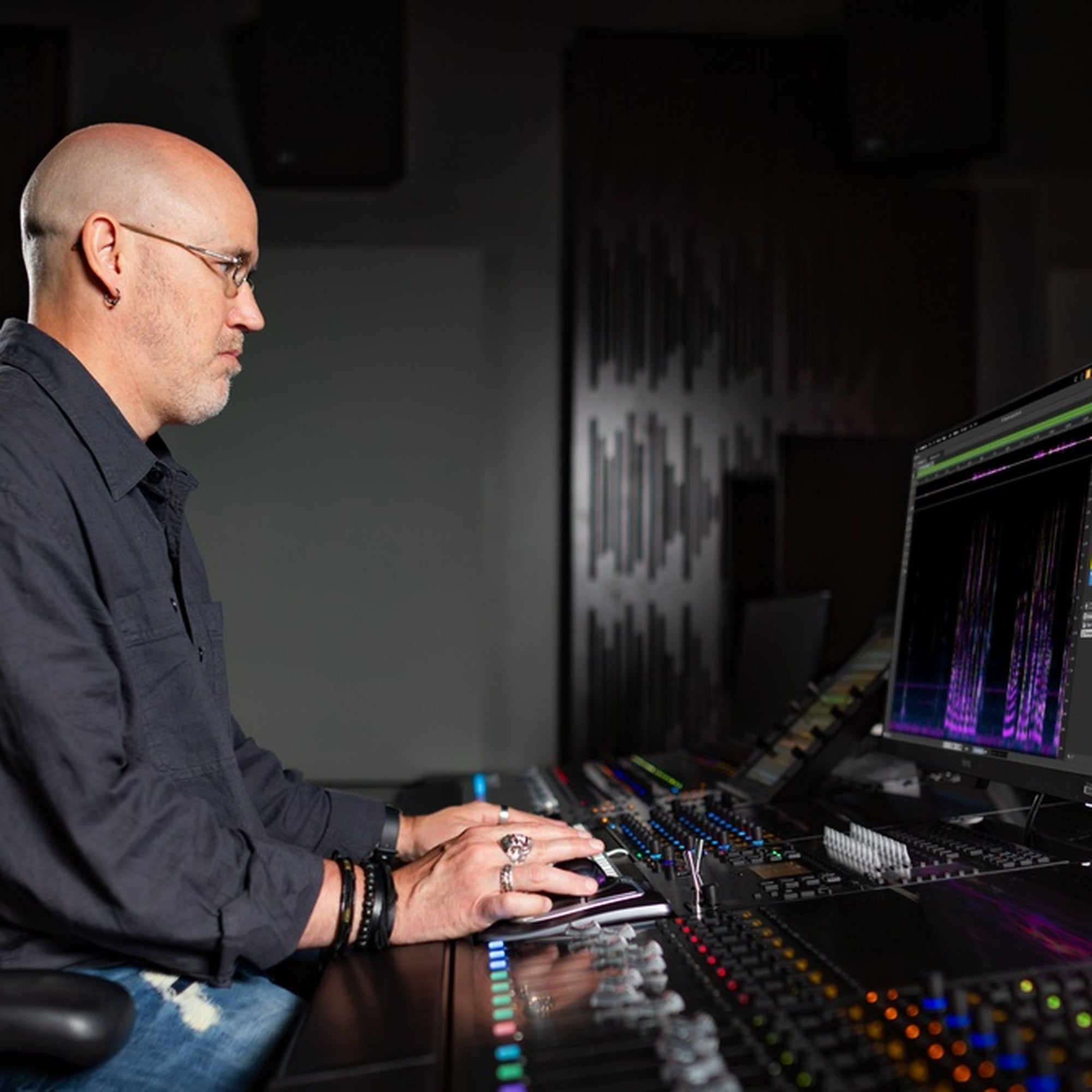 Audio engineer using Steinberg SpectraLayers spectral editing software in a professional studio.