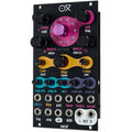OXI Instruments Coral semi-modular synthesizer with patch cables and control knobs, showcasing its compact, colorful design.