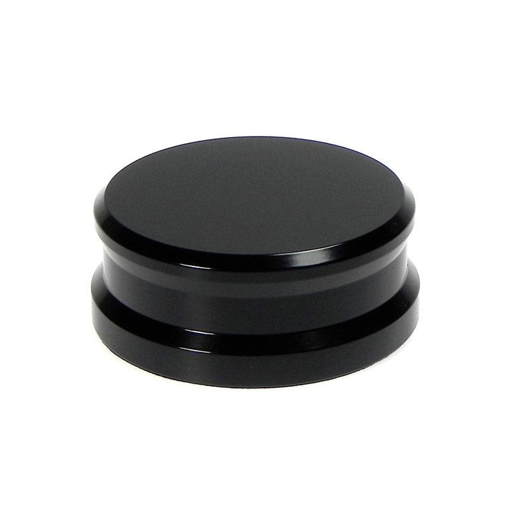 Black Tonar record weight stabilizer with 45 adaptor for vinyl records, enhances sound quality and reduces vibrations.