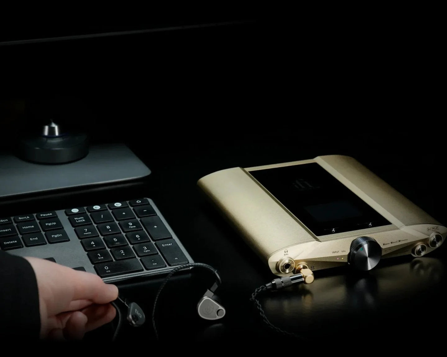 iFi Audio iDSD Valkyrie headphone amplifier and DAC with sleek black design and multiple input/output ports.