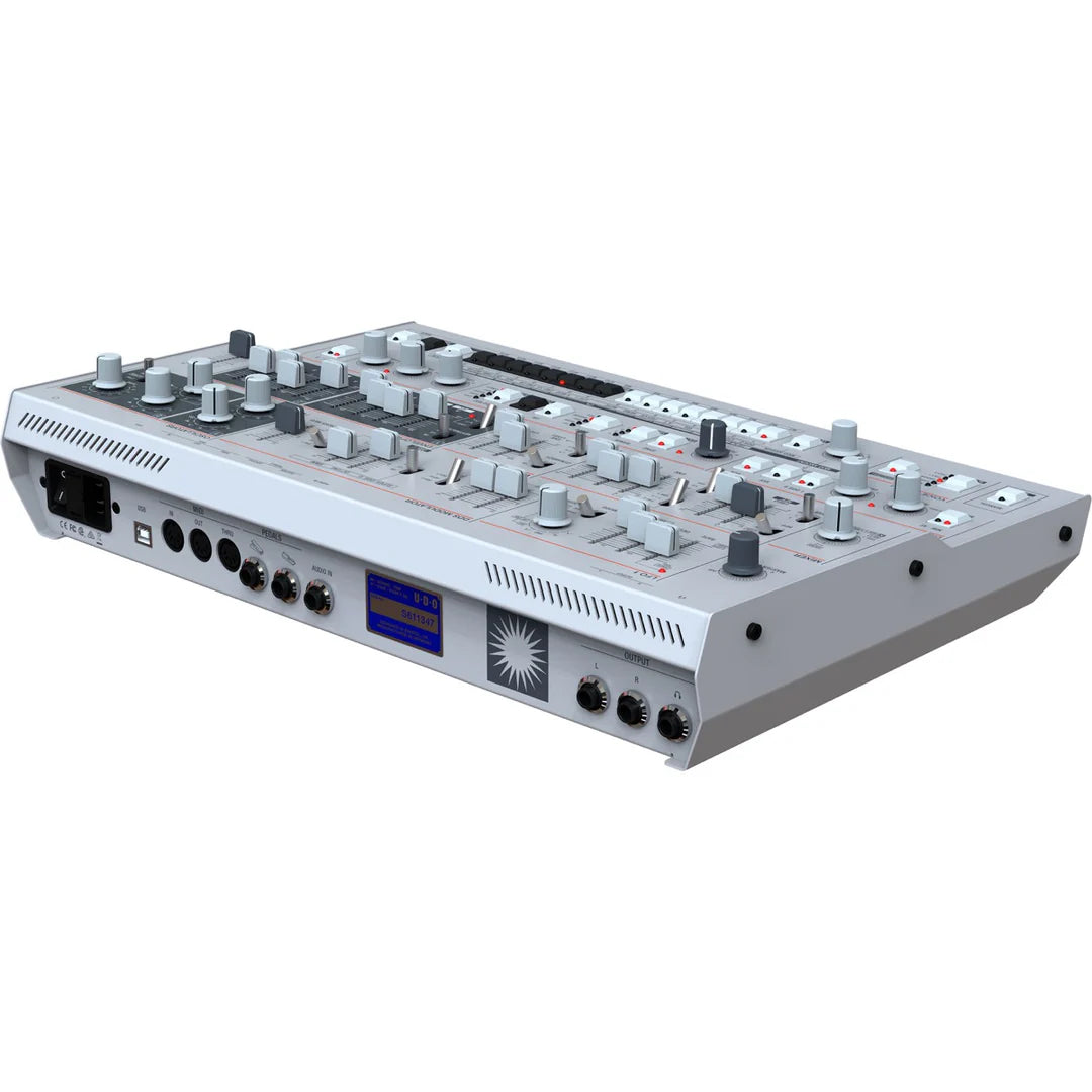 Rear left top view of UDO Audio Super 6 Desktop synthesizer showing control knobs and rear ports.
