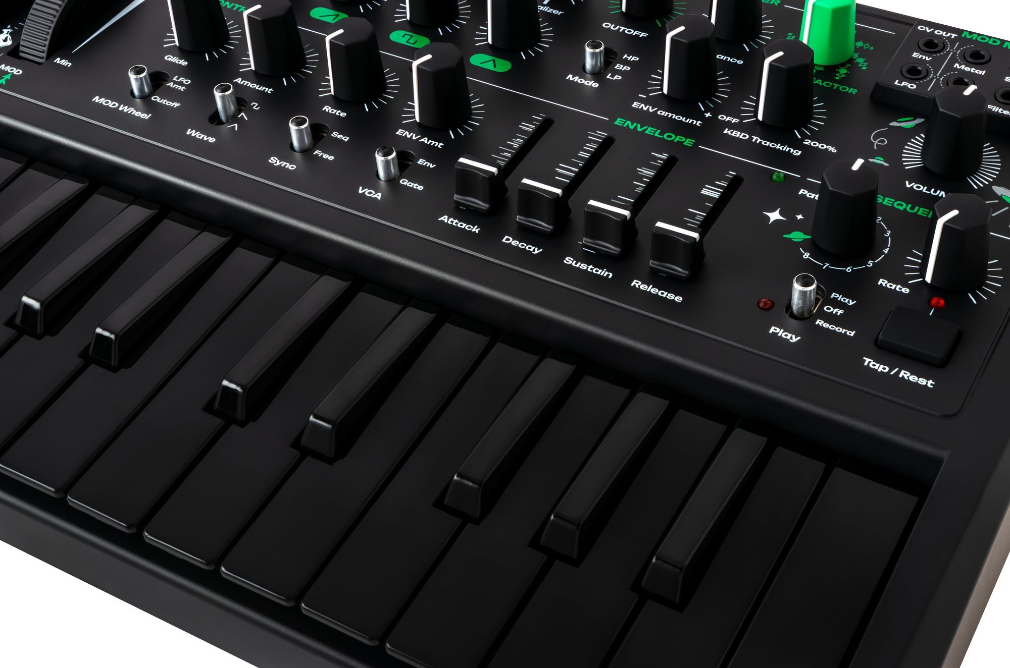 Close-up of the Arturia MicroBrute UFO keyboard synthesizer with detailed knobs and controls on a sleek black finish.