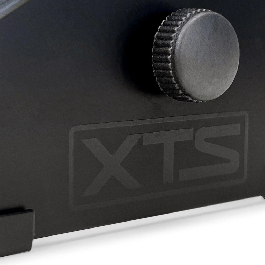Close-up of the Analog Cases XTS Stand small keyboard stand logo with detailed branding and design elements.